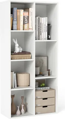 A white bookshelf filled with various decorative items and books.