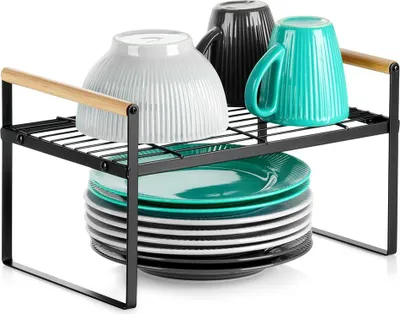 A kitchen shelf organizer holding plates and mugs.