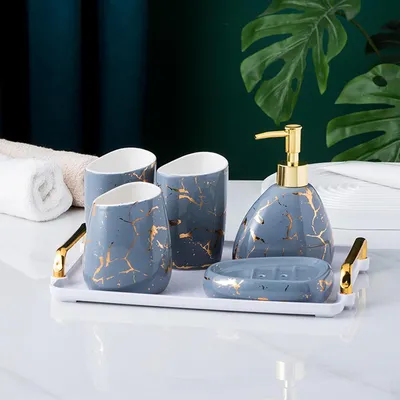 Imagen del producto de Conjunto de accesorios para baño, de 6 piezas, con diseño en gris y efecto mármol dorado, que incluye dispensador de jabón y soporte para cepillos de dientes, ideal para