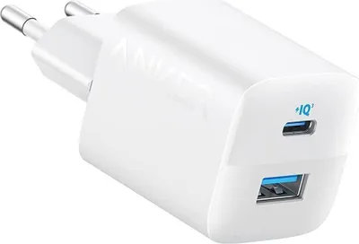 A white Anker 33W charger with two ports (USB-A and USB-C) is shown from a diagonal angle.