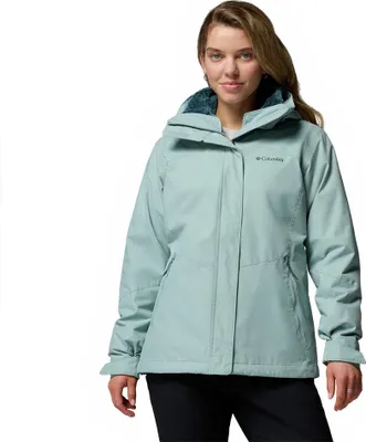 A woman wearing a green Columbia jacket.