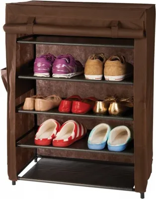 A brown shoe rack with multiple shelves holding various pairs of shoes and slippers.