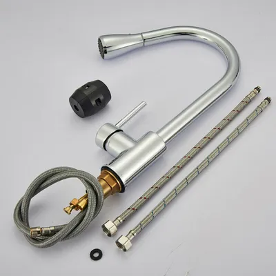 A kitchen faucet and its accessories are laid out on a white background.