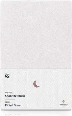 A white fitted sheet with a small section of packaging at the bottom.