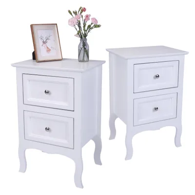 Two white nightstands are displayed against a white background. One nightstand has a framed picture and a vase of flowers on top.