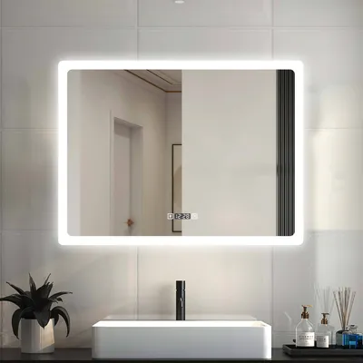 A modern bathroom vanity with a sink, faucet, and a lit LED mirror above it.