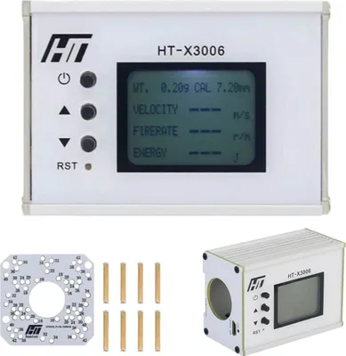 A product shot of a chronograph device and its accessories.
