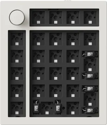 A top-down view of a white mechanical numpad base with a rotary knob.