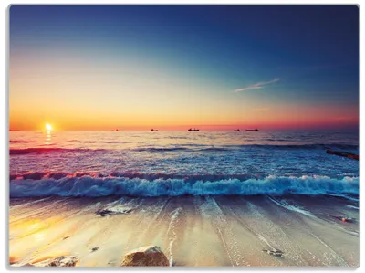 Produktbild von Wallario Glasunterlage, Schneidebrett aus Glas, Größe 30 x 40 cm, Motiv Sonnenuntergang am Meer mit Wellen am Strand