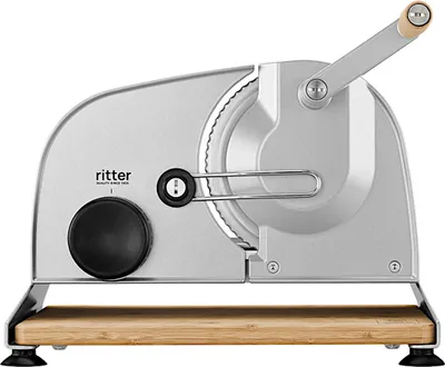 A silver metallic manual slicer with a wooden base.