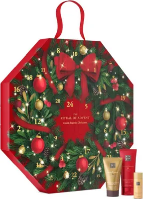 An advent calendar shaped like a wreath, decorated with Christmas ornaments and lights.