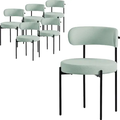 A group of six green chairs are arranged in the background, with one chair in the foreground.