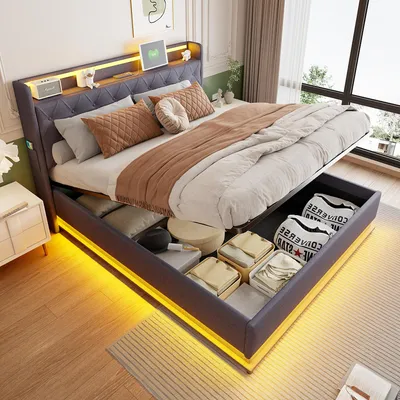 A modern bedroom with a large bed featuring built-in storage and LED lighting.