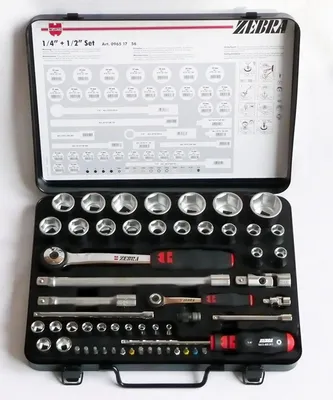 An open metal toolbox containing a set of sockets and wrenches.
