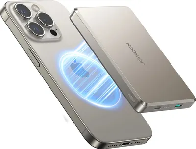A silver iPhone is shown with a magnetic power bank attached to its back, with a blue glowing effect indicating wireless charging.