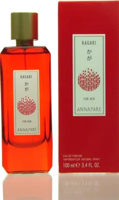 A perfume bottle and its packaging are displayed against a white background.