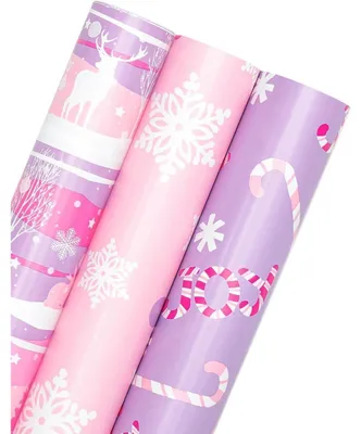 Productafbeelding van Geprinte cadeaupapierrollen, 3 stuks, afmetingen 43,2 cm x 3 m, motieven: rendier, suikerstok, sneeuwvlok, kleuren: roze, paars