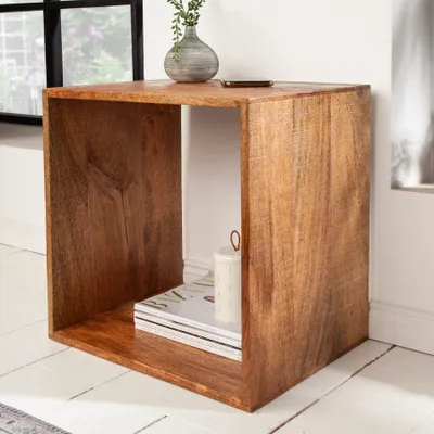 A wooden side table in a room.