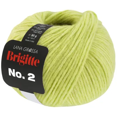 A ball of green yarn with a product label attached.