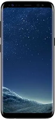 A Samsung Galaxy S8+ Plus smartphone with a starry night wallpaper displayed on its screen, set against a dark blue and gray mountainous landscape.