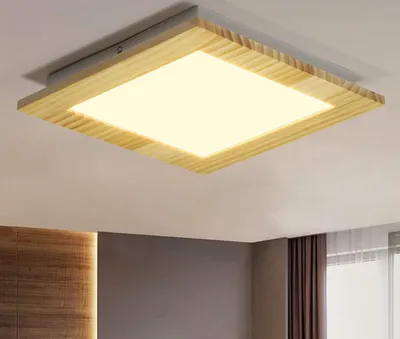A square ceiling light with a wooden frame is mounted on a white ceiling.