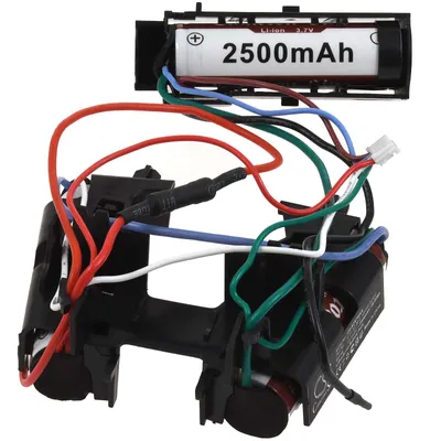 A close-up view of a battery pack with wires and a single battery cell.
