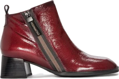 A studio shot of a single red boot.