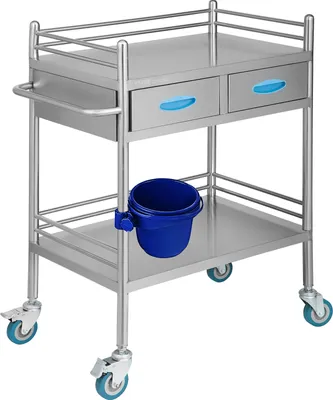 A stainless steel medical cart with two drawers and a blue bucket attached.