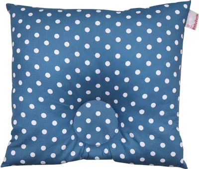 A blue polka dot baby pillow with a central indentation.