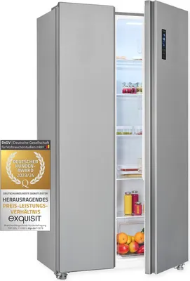 A silver refrigerator with one door open, revealing shelves stocked with drinks and fruit. A badge award is visible on the front of the refrigerator.