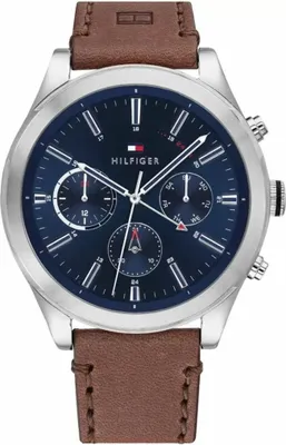 A close-up studio shot of a Tommy Hilfiger watch.