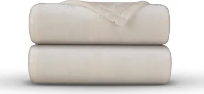 Two rolled-up blankets are stacked on top of each other against a white background.