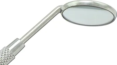 A close-up, studio shot of a dental mirror on a white background.