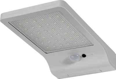 A close-up, angled view of a white LED solar outdoor light with a motion sensor.