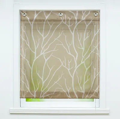 A window with a decorative roller blind featuring a white tree branch pattern on a brown background.