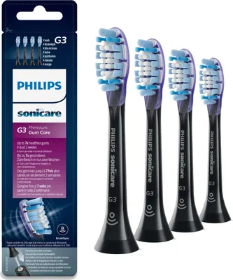 A product package containing four Philips Sonicare G3 Gum Care toothbrush heads, with the toothbrush heads displayed next to the packaging.