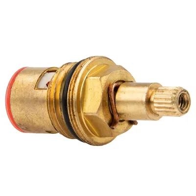A close-up studio shot of a brass faucet cartridge on a white background.