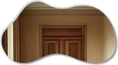 A reflection of a wooden door and wall in a mirror.