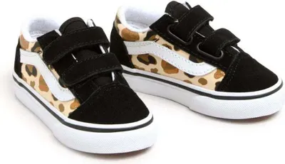 A pair of children's Vans Old Skool V sneakers with a leopard print pattern.