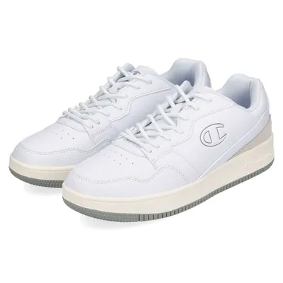 A pair of white Champion low-top sneakers.