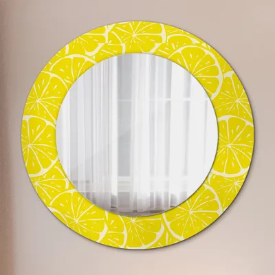 A round mirror with a lemon slice pattern on its frame, displayed against a light gray wall.