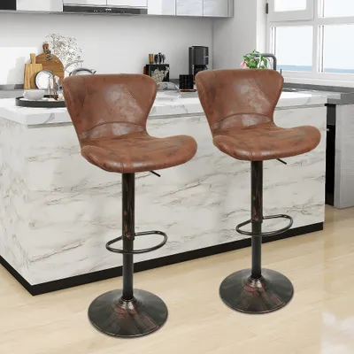Two brown leather bar stools are shown in a kitchen setting.
