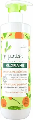 A bottle of Klorane Junior Detangling Shampoo with peach and oat.