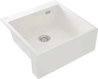 A white granite sink is shown from a diagonal angle.