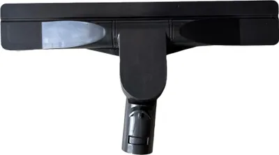 A close-up studio shot of a black vacuum cleaner attachment on a white background.