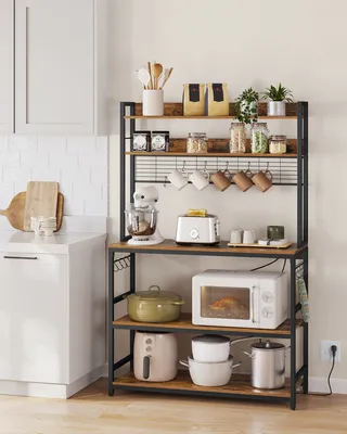A kitchen scene featuring a microwave rack filled with kitchen appliances and cookware.