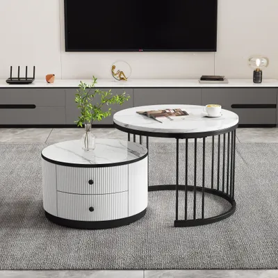 A living room scene with two round coffee tables, a TV stand, and a television.