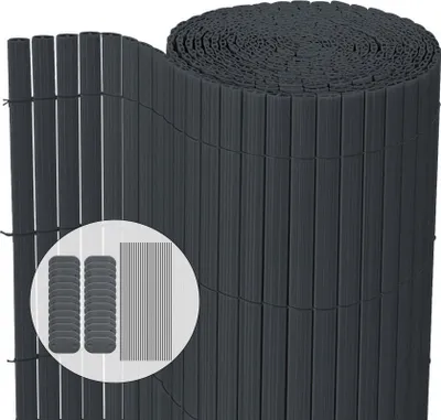 A rolled-up privacy screen made of dark gray PVC.