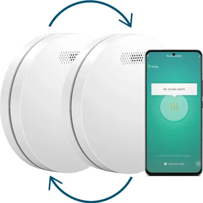 Two white smart smoke detectors are shown next to a smartphone displaying a smoke detector app.