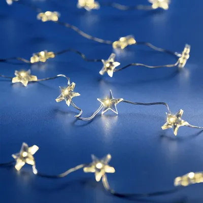 A string of star-shaped LED lights on a dark blue background.